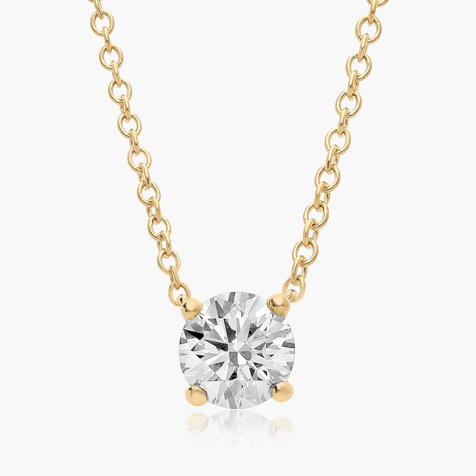Solitaire Lab Diamond Pendant: 0.25 ct (F-G, VS2-SI1) in a 14K Yellow/White Gold 4-Prong Basket Mount.