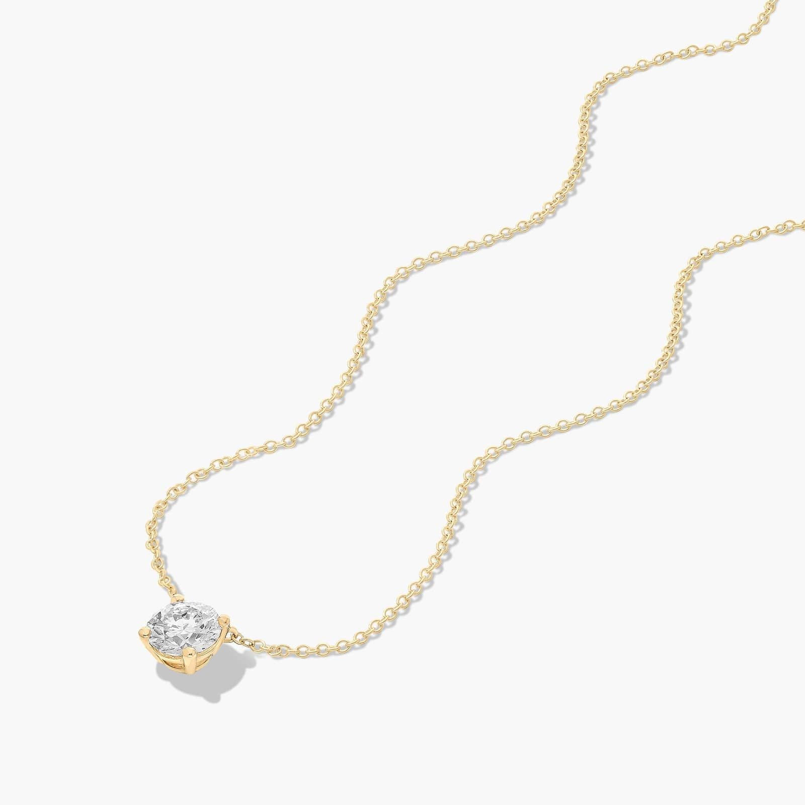 Solitaire Lab Diamond Pendant: 0.25 ct (F-G, VS2-SI1) in a 14K Yellow/White Gold 4-Prong Basket Mount.